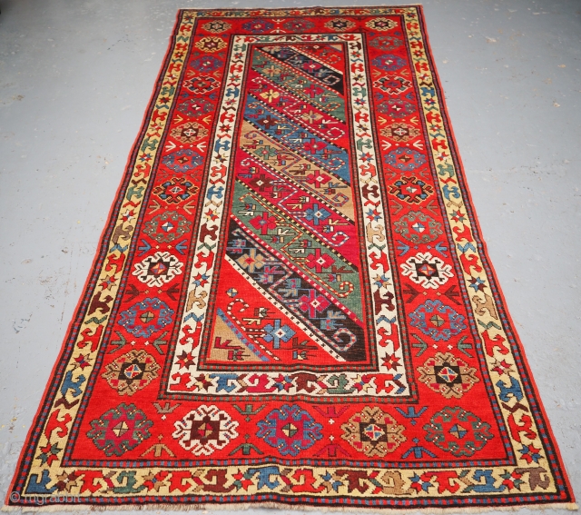 Antique Caucasian Gendje Kazak long rug with diagonal stripe design. www.knightsantiques.co.uk 
Size: 8ft 11in x 4ft 0in (271 x 123cm). 
Circa 1890.

A good example of a Gendje long rug, multi coloured stripes  ...