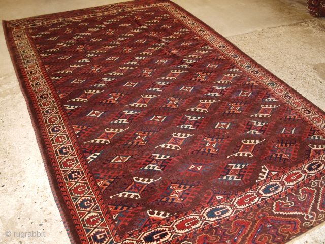 Antique Yomut Turkmen main carpet with the ‘Dyrnak’ gul design and curl leaf border. www.knightsantiques.co.uk 

Circa 1890.

The carpet has a rich brown ground colour with some very nice blues, greens, ivory and  ...