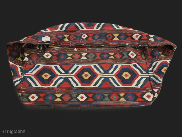 A complete south Caucasian or Shahsavan mafrash storage bag with striped base.

Circa 1890.
Size: 3ft 6in x 1ft 9in (106 x 53cm) side panel size.
An excellent example of a mafrash storage bag, used  ...