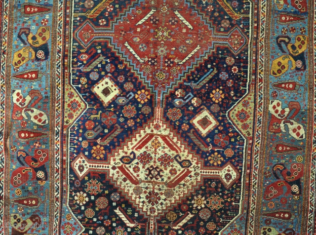 An antique Khamseh carpet very rare and quite beautiful border. Low pile in places with some small moth holes and other damages. Mid 19th century        