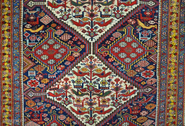 An antique Khamseh carpet. Well drawn example with many birds and beautiful glowing colours. Good solid condition, even low pile all-over, very clean. 19th century.297x148cm.        