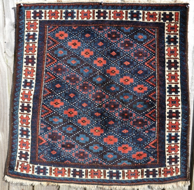 an old Baluch square, with great wool and lots of juicy aubergine dye. Not sure if its a big bag or a rug...? 79x75cm         