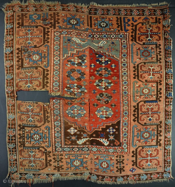 An antique Konya rug, woven in 2 halves, with some patches, losses to ends and a big hole. But mainly in good pile. All good dyes. Funky border! 1st half 19th century.  ...