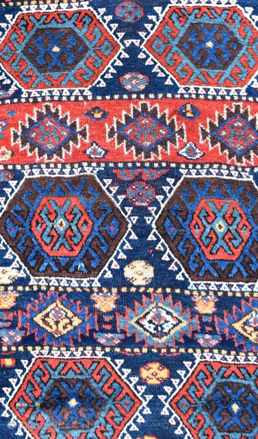 An antique Sinjabi Kurdish rug from North West Persia. A beautiful tribal rug with glowing natural dyes and good wool. Both decorative and collectable, this wonderful old rug is in exceptional condition  ...