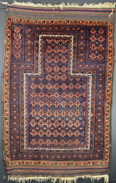 An antique Baluch prayer rug with shiny wool and good dyes in excelent condition, just  very slight local wear in one small area and some wear to one selvage. 160 x  ...