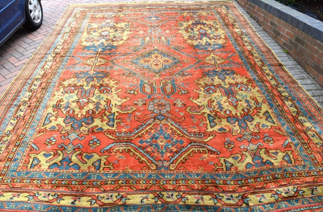 An antique Turkish Ushak carpet. Glowing natural dyes including a particularly attractive ground colour. All over Smyrna design of grand scale. A very decorative piece in excellent condition, full pile with original  ...