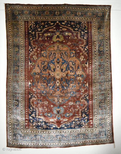 A very Fine antique Heriz Silk rug. A top flight collectable piece woven with beautiful, arabesque filled medallion on soft red ground. The silk on silk rugs are marvels to behold, technically  ...