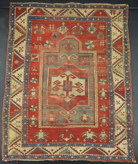 A good Fahcralo Kazak, filthy and worn, but with kilim ends and original sides. Circa 1870. Very fresh to the market. Price includes international shipping. 140 x 110 cm.    