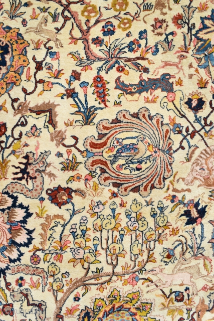 An Old Persian Tabriz carpet of Benlyan type. A highly decorative item with all-over palmetes and hunting animals woven in muted dyes on soft ivory ground. The piece is in excellent, original  ...