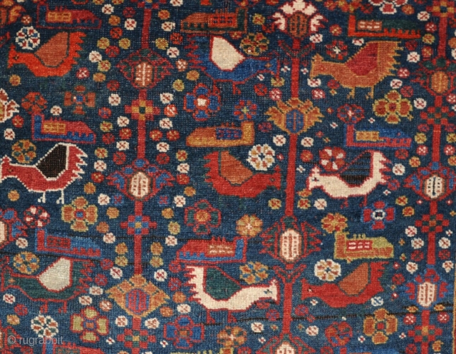 An antique Afshar rug, unusual with the chicken design more usually associated with Khamseh work. All good dyes in good, original condition, with kilim ends and no repair. Images taken indoors with  ...