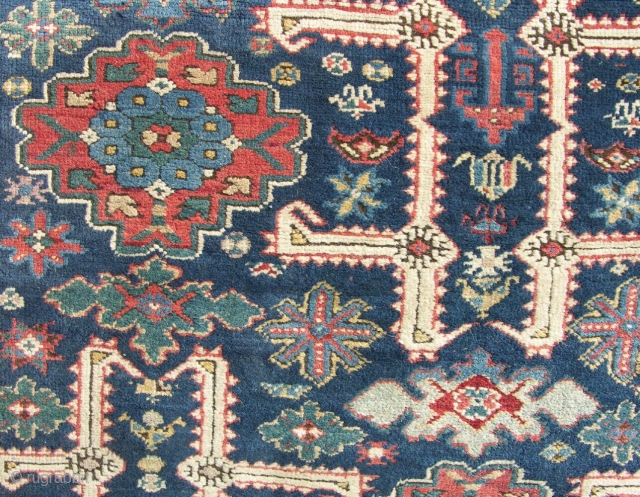 An antique Kuba carpet, circa 1880. 2 patches of lcal wear but mainly in full pile with original ends and sides and no repair. Perfect for resoration. 10x4 ft.    