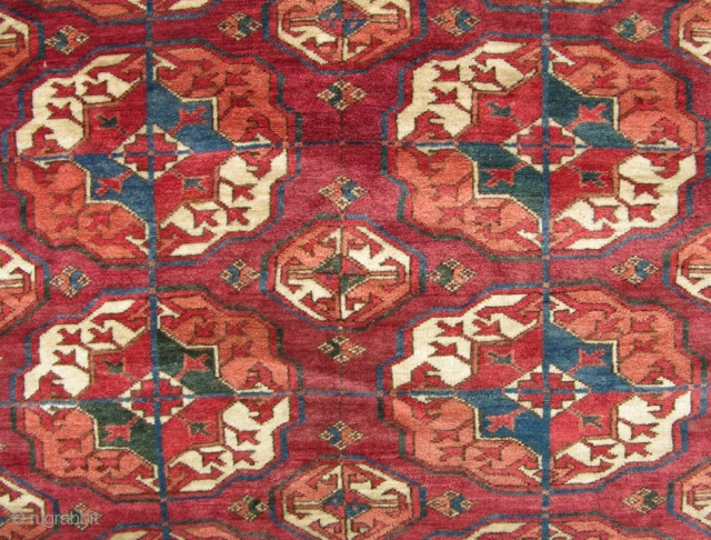 a Fine old Tekke main carpet with good dyes and shiney wool in mint condition with no repairs. Very crisp clean piece. 10x7. late 19th century.       