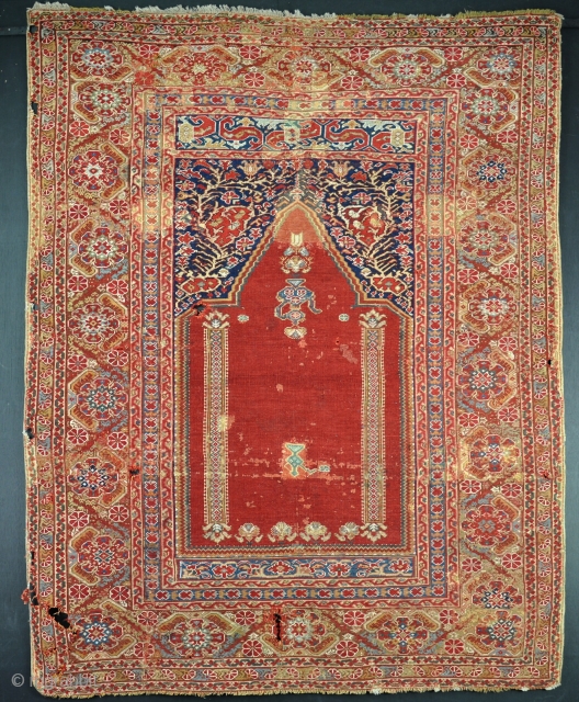 A good Giordes prayer rug in as found condition, dirty with some moth holes and early faded repairs, but very fine with great colour and presence. Fresh from the english countryside. 2nd  ...