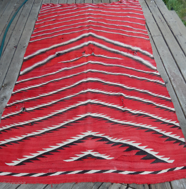 Navajo Weaving   Late 19th Century -  Early  20th Century  --  Size 9'3"  x  5'3"  --  This piece has damage, see the photos.  ...