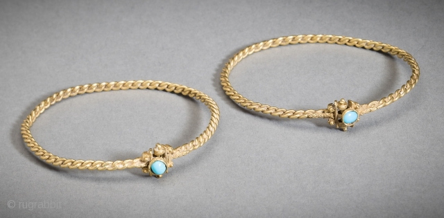 Jewelry Auction Nov 30, 2016: Matched pair of Islamic gold bracelets set with turquoise cabochons (Est: $10,000/$12,000).

An exquisite rare matched pair of Islamic gold bracelets of heavy fused braided wire, original pin-clasps  ...