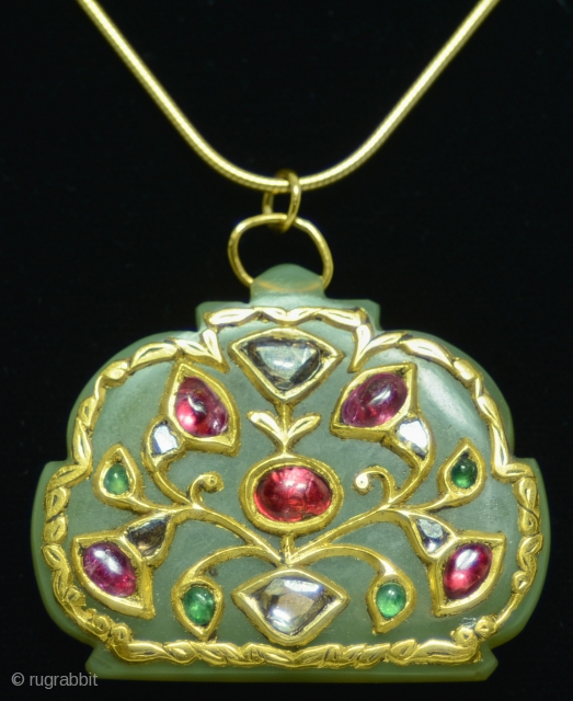 Jewelry Auction Nov 30, 2016: Holdali Jade Pendant (Est: $3,000/$5,800). 

Rajasthan, Northern India. Antique, 19th century jade "Holdali" pendant from India, studded with diamonds, rubies and emeralds. Also known as Mutton Chop  ...