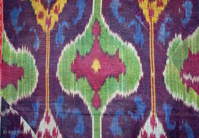 19th cent beatiful uzbek ikat fragment.it has very good veg dyes colours. very unusual desing.the size is 128 by 45cm. for more information please mail me.       