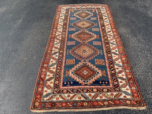 Caucasian Kazak, circa 1900, 4-4 x 8-8 (112 x 190), good condition, rug was washed, wear, few creases, one end original braiding finish, moth bites, browns oxidized, plus shipping.    