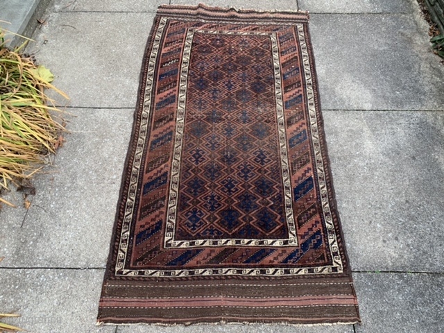 Persian Baluch, late 19th century, 3-2 x 6-8 (97 x 203), rug was hand washed, browns oxidized, floppy handle, 5 small holes, even wear, original edges, original kilim ends 3” and 5”,  ...