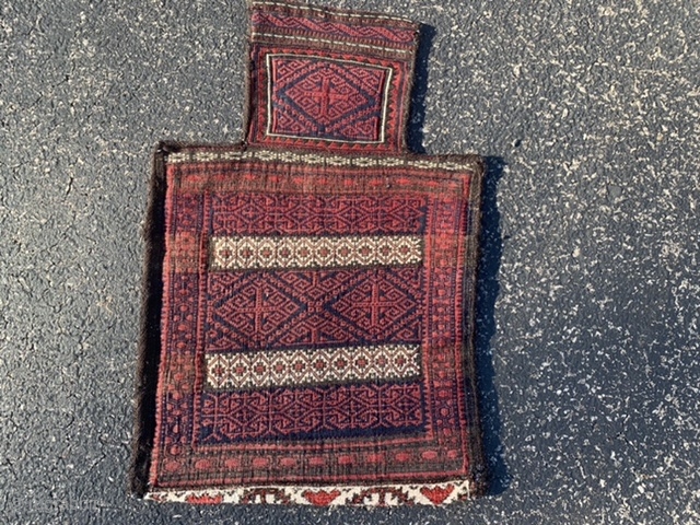 Persian Baluch Salt (Namakdan) bag, late 19th century, 1-3 x 1-11 (38 x 58), rug was washed, soumac front, kilim back, pile bottom skirt, nice handle, excellent work, slight dye run in  ...