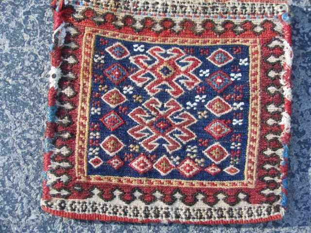 Persian Lori/Bakhtiar Chanteh Soumak bag, 7" x 7", late 19th century, weft wrapping technique, small discolored area top left border, good condition, comb design kilim back, nice colors.     