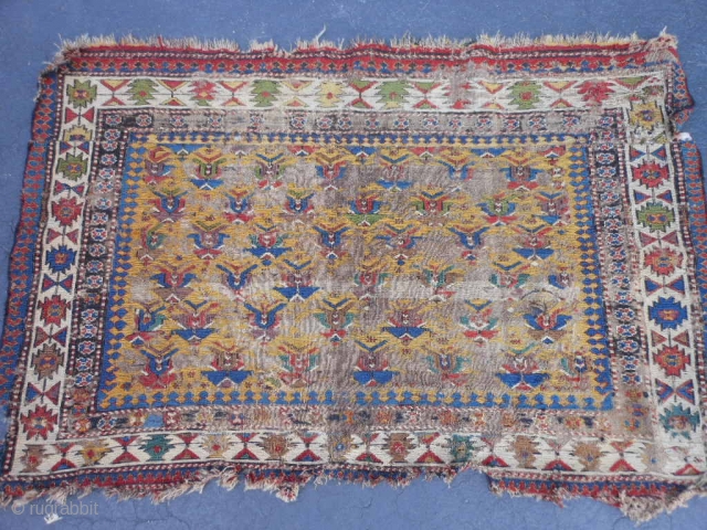 Caucasian Soumac fragment, late 19th century, 2-5 x 3-8 (.74 x 1.12), great greens and yellow, cut and rejoined, worn, holes, rug was washed, plus shipping.       