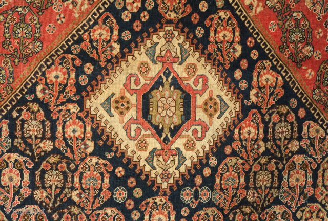 Qashqa'i rug, late 19th century.  Possibly Kashkuli. Elegant botehs and overall composition.  Subtle color scheme also adds to the rug's elegant feel.  Deep indigo blue ground.  Pile is  ...