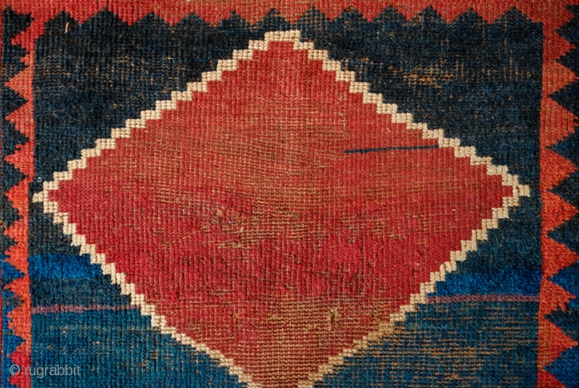 Qashqa'i Gabbeh, Mid 19th Century. Beautiful saturated colors including a rich purple in one of the serrated borders.  Two human figures woven into the field.  The design forms a mihrab  ...