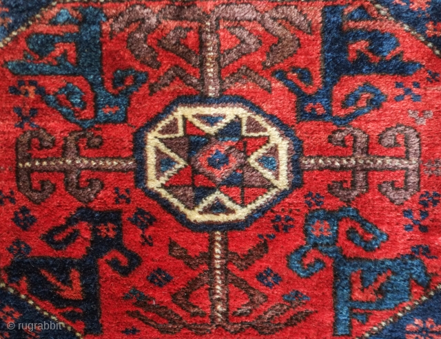 Baluch bag face, 19th century. Floral motifs surrounding the central medallion enclosing derivative dragon motifs.  Plush silky wool.  A small piece taken out of the bottom right side.  80  ...