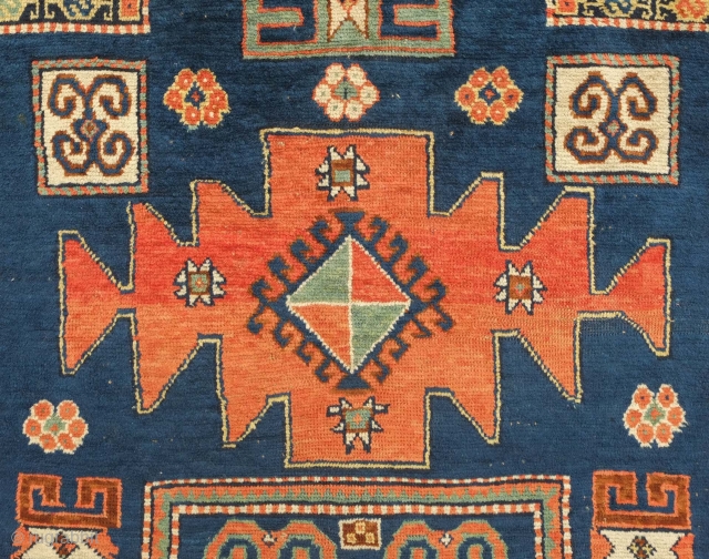 Karachof Kazak rug, 19th century.  Mellower shades in natural dyes.  In good condition with a reconnected tear at the bottom and some slightly lower pile in the medallions.    ...