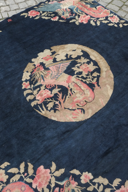 Peking Chinese square rug, 19th century.  There are rooster motifs in the center roundel and in each of the four corners on a field of deep indigo as well as a  ...