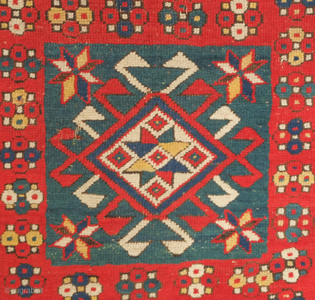 Kazak rug, 3rd to 4th quarter of the 19th century.  Hooked medallions in squares and a crab leaf border.  Good pile and general condition. 110 x 224 cm   