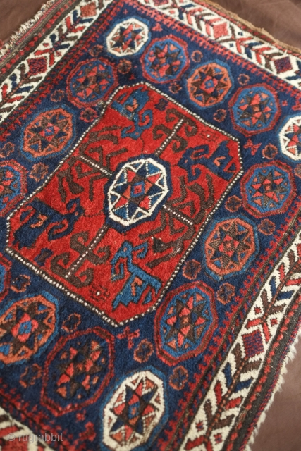 Baluch bag face, 19th century. Excellent soft pile and overall condition. Abstracted dragon motifs in the four corners of the central medallion. One of the blues is that Timuri electric blue. A  ...