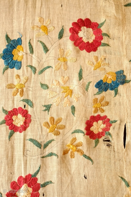 Ottoman Embroidery, 18th Century. Overall floral motif in strong, vibrant colors in silk on linen. The maroon-brownish silk has been coroded in the stems and border outlines. This is a complete suzani.  ...