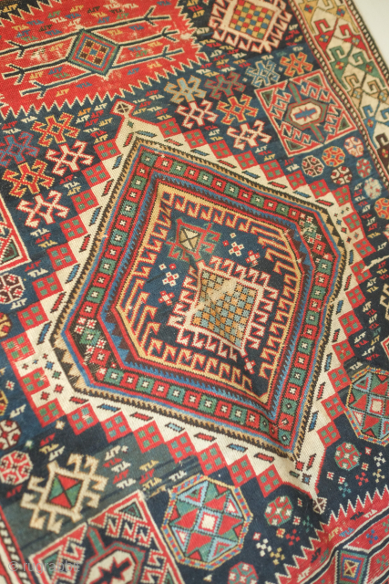 Shirvan rug, atypical small format, 19th century.  The rug is complete with some wear here and there but otherwise intact.   117 x 141 cm.  Contact danauger@tribalgardenrugs.com   
