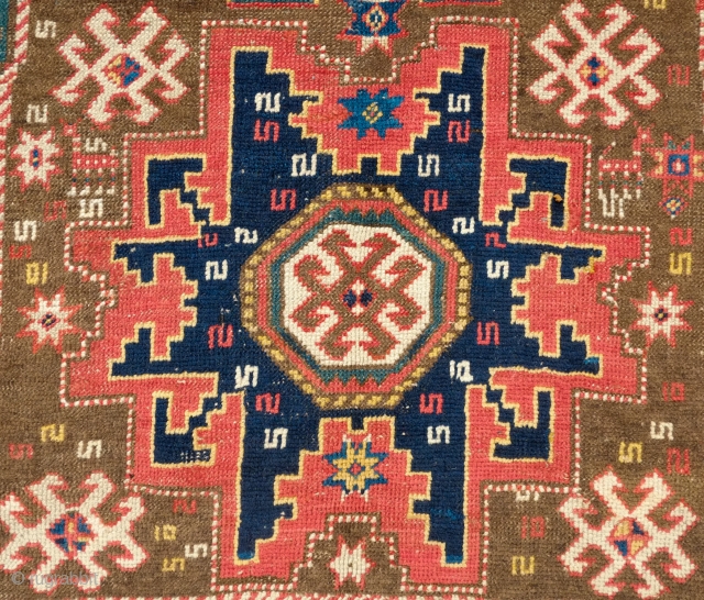 Lesghi Star Rug, 3rd to 4th quarter of the 19th century.  The stars appear to float on top of the ground field.  The main border is in a beautiful rosette  ...