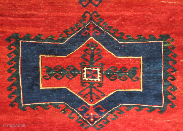 Kazak rug, late 19th century.  Deeply saturated colors with fluidly drawn serrated decagons. The organic quality of these medallions and other design elements almost gives this rug the feel of a  ...