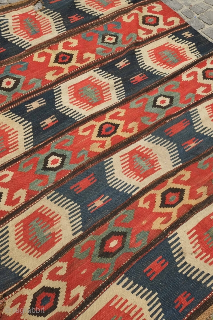 Borchalo Kazak kilim, 19th century.  Wide bands.  Fingered medallions.  Good age and colors. A hole at the top which can easly be repaired.  176 x 209 cm   ...