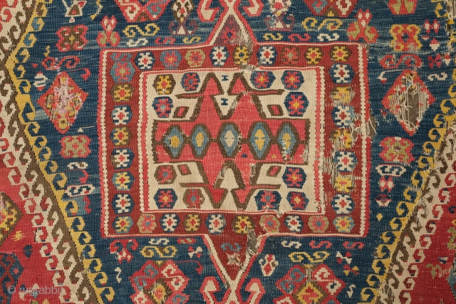 Central Anatolian Kilim, mid-19th century.  A blitz of colors.  Strongly archaic designs.  Very ethnographic and filled with portent. Rare type. 183 x 310 cm.      