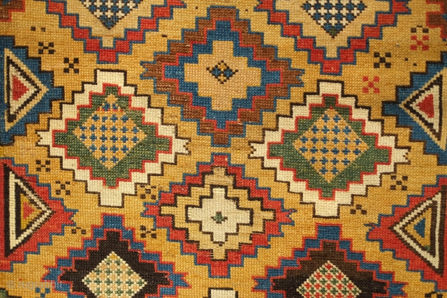 Daghestan Rug, 3rd-4th Quarter of the 19th Century. Wonderful color scheme. Unusual design with trees of life on the bottom. Visually keeps the eye interested. 118 x 193 cm.
    