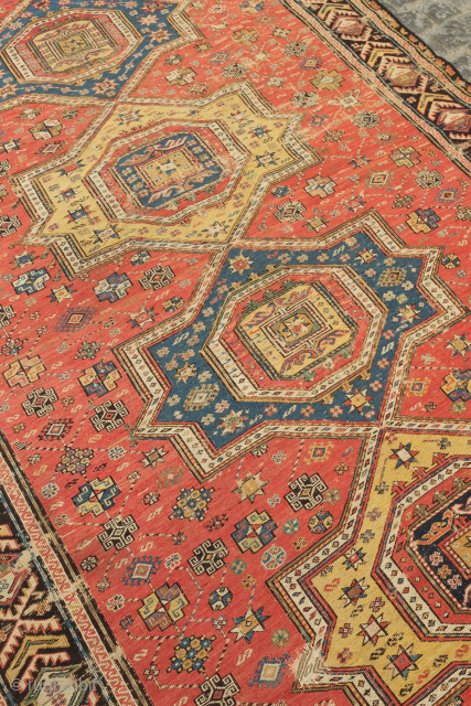 Caucasian Soumak, mid-19th century or earlier.  The colors are all good in this piece which includes a rich purple. It is in generally good condition with some scrapes here and there  ...