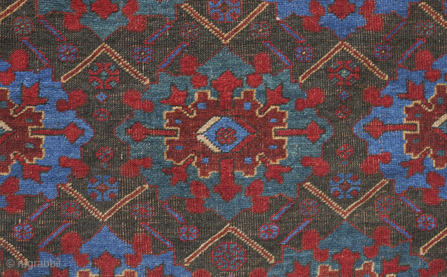 Afshar rug, 19th century. Large florals in an electric blue and deep green on a black ground. Pile is low with corrosion in the black but it is all there. ...