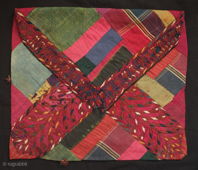 Turkmen Koran cover pouch, late 19th or early 20th century.  It was made using various pieces of naturally dyed silk and wool with fine embroidered bands criss-crossing the front and flap.  ...