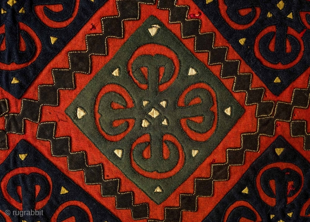 Yomut Broadcloth Applique Asmalyk, 4th quarter of the 19th Century. Wool felt applique. Wonderful graffic. Natural dyes in green, deep indigo, red, brown and cotton gauze highlights in yellow. In very good  ...