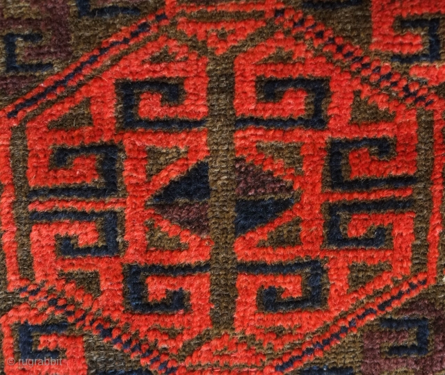 Baluch rug from the fourth quarter of the 19th century.  The wool is excellent quality and soft.  The design is in a repeat hooked octagon motif in rich reds and  ...