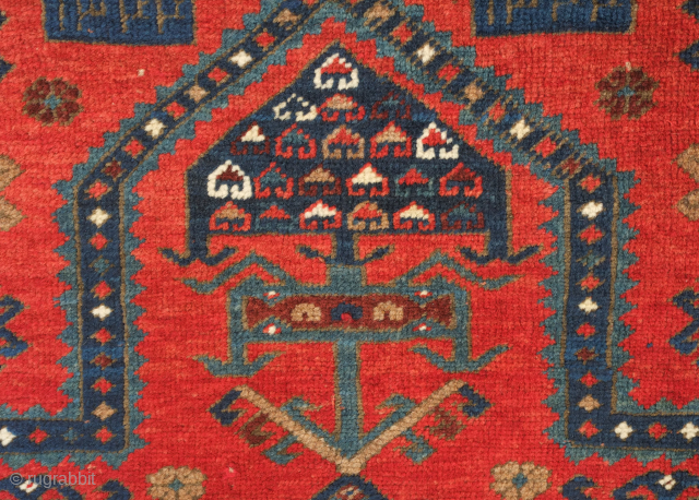 Kazak prayer rug dated to 1907(1322). Some wonderful archaic graphic elements on a deep red ground. It has a couple of very small areas of re-piling and a small section on the  ...