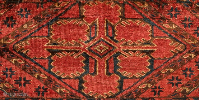 Beshir torba face, 19th century.  Striking large, centrally placed floral motif.  A small area secured along the bottom left selvage.  A solid piece.  43 x 126 cm  