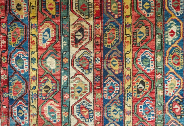 Genje Shawl Design Rug, 4th quarter of the 19th century.  Wonderful array of colors, counting around seven.  The Kashmir boteh shawl design is elegantly articulated in wider stripes than usual.  ...