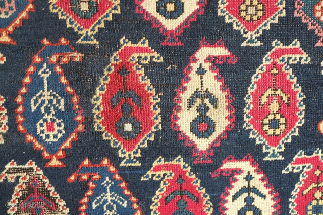 Shirvan Prayer Rug, 4th quarter of 19th Century.  Deep indigo blue ground and wonderful botehs in alternating directions.  The serrations around the botehs have the appearance of small "horns" on  ...