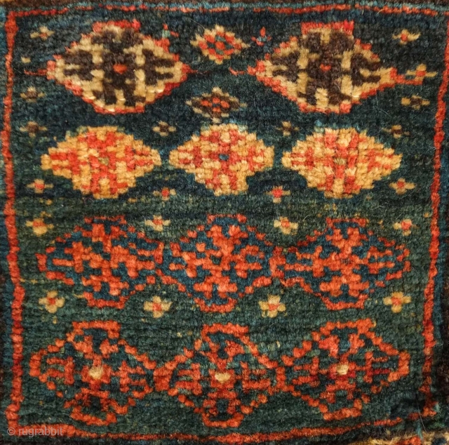 Qashqa'i Chanteh, 19th century.  Deep green-blue ground.  Vivid striped back.  Well executed soumak work on the top.  All good colors.  Selvedge missing and there is a small  ...